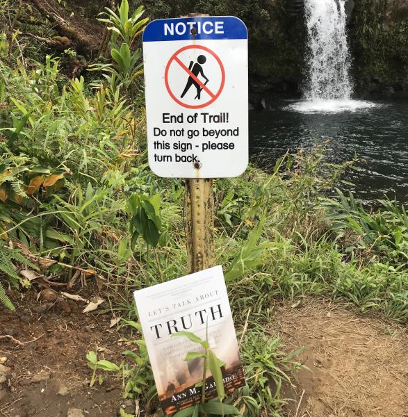 book in front of sign